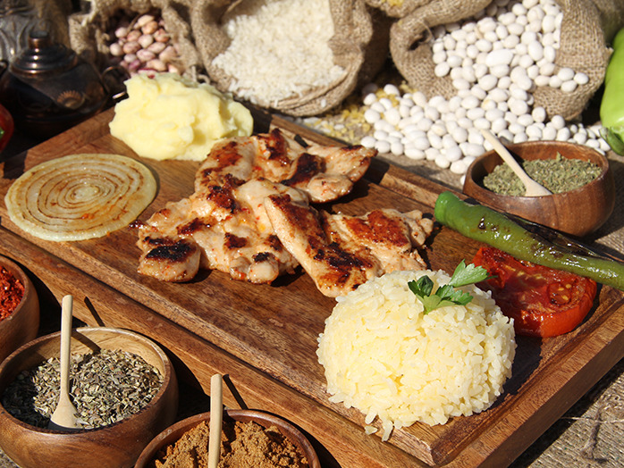 Fasuli Lokantası signature dishes İspir Kuru Fasulye (slow-cooked white beans from İspir), Rice Pilaf, Pickles